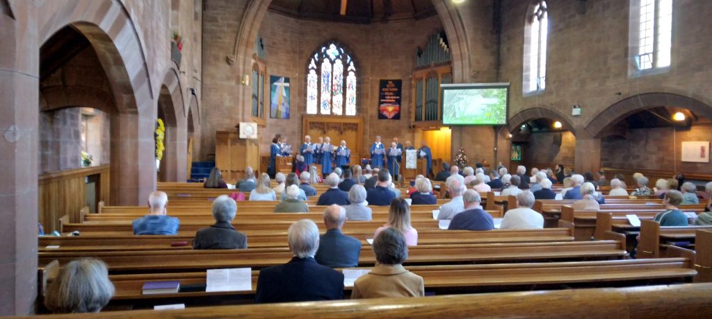 People at prayer in the Netherlee Church